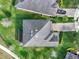 Aerial view of home with mature landscaping, driveway, and modern roof at 2505 Civitas Pl, Casselberry, FL 32707