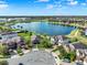 An aerial shot of houses near a lake with mature trees in a suburban neighborhood at 2505 Civitas Pl, Casselberry, FL 32707