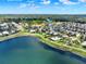Aerial view of community featuring lake, walking path, and neighborhood pool at 2505 Civitas Pl, Casselberry, FL 32707