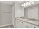 Bathroom with a double sink vanity featuring granite countertops and white cabinets at 2505 Civitas Pl, Casselberry, FL 32707