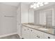 Bathroom with a double sink vanity featuring granite countertops and white cabinets at 2505 Civitas Pl, Casselberry, FL 32707