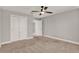 Spacious bedroom features a ceiling fan and closet with double doors at 2505 Civitas Pl, Casselberry, FL 32707
