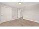 Bedroom featuring closet with double doors with neutral-colored carpet and walls at 2505 Civitas Pl, Casselberry, FL 32707