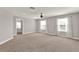 Spacious bonus room with a ceiling fan, neutral carpet, and natural light at 2505 Civitas Pl, Casselberry, FL 32707