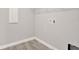 Bright laundry room featuring neutral paint, tile flooring, and wire shelving at 2505 Civitas Pl, Casselberry, FL 32707