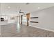 Bright living room featuring ceramic tile floors, modern ceiling fan, and open access to kitchen area at 2505 Civitas Pl, Casselberry, FL 32707