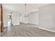 Large living room with ceramic tile floors, decorative lighting, and ample space for furnishings at 2505 Civitas Pl, Casselberry, FL 32707