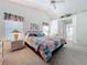 Spacious bedroom with lots of light from the windows, vaulted ceilings, and ensuite bathroom access at 25110 Meriweather Rd, Leesburg, FL 34748