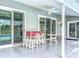 Spacious screened lanai, featuring ample seating areas and direct access to the pool at 25110 Meriweather Rd, Leesburg, FL 34748