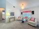 Cozy living room featuring comfortable seating and natural light from the window at 25110 Meriweather Rd, Leesburg, FL 34748