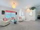 Comfortable living room with cozy chairs and neutral carpet, perfect for relaxing at 25110 Meriweather Rd, Leesburg, FL 34748