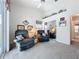 Living room features vaulted ceiling, ceiling fan, plush chairs, and mirrored closet at 25110 Meriweather Rd, Leesburg, FL 34748