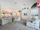 Spacious living room with vaulted ceilings, plush seating, and an open floor plan at 25110 Meriweather Rd, Leesburg, FL 34748