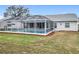 Enjoy this screened-in pool and patio area in your backyard with beautiful landscaping at 25110 Meriweather Rd, Leesburg, FL 34748