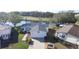 Aerial view of charming single-story home with a spacious two-car garage near a picturesque pond and golf course at 25447 Belle Alliance, Leesburg, FL 34748