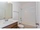 Bright bathroom featuring a quartz countertop and combined shower and bathtub at 2824 Supermarine Rd, Tavares, FL 32778