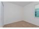 Bedroom with neutral carpet, a window and white walls at 2824 Supermarine Rd, Tavares, FL 32778
