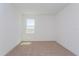 Cozy bedroom with neutral carpet, and a bright window at 2824 Supermarine Rd, Tavares, FL 32778
