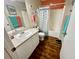 Well-lit bathroom featuring nautical-themed decor, a shower and tub combination, and modern fixtures at 2910 Barboza Dr, The Villages, FL 32162