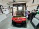 View of a red Club Car golf cart in an organized garage with a concrete floor, and tools hanging on a pegboard at 2910 Barboza Dr, The Villages, FL 32162