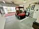 Spacious garage featuring a golf cart, providing convenient parking at 2910 Barboza Dr, The Villages, FL 32162