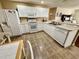 Efficient kitchen design featuring white cabinets and ample counter space for meal preparation at 2910 Barboza Dr, The Villages, FL 32162