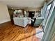 Inviting living room with hardwood floors, comfortable seating and open to kitchen at 2910 Barboza Dr, The Villages, FL 32162
