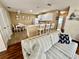 Cozy living room with open concept design, seamlessly connecting to the kitchen and dining area at 2910 Barboza Dr, The Villages, FL 32162