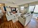 Relaxing living room featuring comfortable seating and a sliding glass door to the outside at 2910 Barboza Dr, The Villages, FL 32162