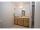 Well-lit bathroom with a classic vanity and ample storage at 2930 Cr 416N, Lake Panasoffkee, FL 33538