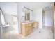 Bright bathroom with natural light, vanity, and seamless access to shower and bedroom at 2930 Cr 416N, Lake Panasoffkee, FL 33538
