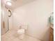 Simple bathroom featuring walk-in shower, standard toilet, and tiled flooring at 2930 Cr 416N, Lake Panasoffkee, FL 33538