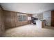 Spacious bedroom featuring wood paneling and natural light at 2930 Cr 416N, Lake Panasoffkee, FL 33538