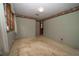 Bedroom features neutral paint, decorative trim, and natural light from the window at 2930 Cr 416N, Lake Panasoffkee, FL 33538