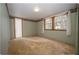 Calm bedroom featuring neutral walls, decorative trim, and natural light from the windows at 2930 Cr 416N, Lake Panasoffkee, FL 33538