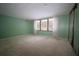 Neutral-toned bedroom with wall to wall carpet and natural light at 2930 Cr 416N, Lake Panasoffkee, FL 33538