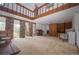 Spacious living room boasts high ceilings, natural light, brick accents, and vintage charm at 2930 Cr 416N, Lake Panasoffkee, FL 33538