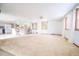 Open-concept living area with bright natural light, and direct access to the kitchen at 2930 Cr 416N, Lake Panasoffkee, FL 33538
