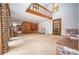 Spacious living room features brick fireplace, vintage shelving, and a cozy seating area at 2930 Cr 416N, Lake Panasoffkee, FL 33538