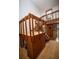 Unique staircase design with wood accents, seamlessly integrated with built-in storage, adding character to the home's interior at 2930 Cr 416N, Lake Panasoffkee, FL 33538