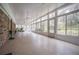 Bright sunroom with lots of windows, a ceiling fan, and outdoor views at 2930 Cr 416N, Lake Panasoffkee, FL 33538