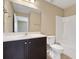 Bathroom features a dark wood vanity and shower-tub combo at 30342 Gidran Ter, Mount Dora, FL 32757