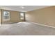 Spacious bedroom featuring neutral carpeting, natural light from two windows, and ample room at 30342 Gidran Ter, Mount Dora, FL 32757