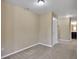 Cozy bedroom with a neutral color scheme, carpet flooring, and access to an en-suite bathroom at 30342 Gidran Ter, Mount Dora, FL 32757