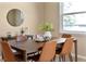 Inviting dining room with a wooden table, stylish leather chairs, and a window with plenty of natural light at 30342 Gidran Ter, Mount Dora, FL 32757