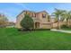 Charming two-story home with manicured lawn, mature tree, and well-maintained landscaping at 30342 Gidran Ter, Mount Dora, FL 32757