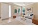 Inviting living room featuring neutral tones, large windows, and modern furnishings at 30342 Gidran Ter, Mount Dora, FL 32757