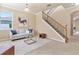 Cozy living room features stairs, light colored walls, and modern decor at 30342 Gidran Ter, Mount Dora, FL 32757