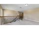 Spacious loft area featuring wood and iron staircase at 30342 Gidran Ter, Mount Dora, FL 32757