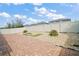 Spacious backyard featuring a brick patio, rock beds, small palm trees, and a fire pit area for outdoor enjoyment at 3139 Hurston Watch Ln, Clermont, FL 34711